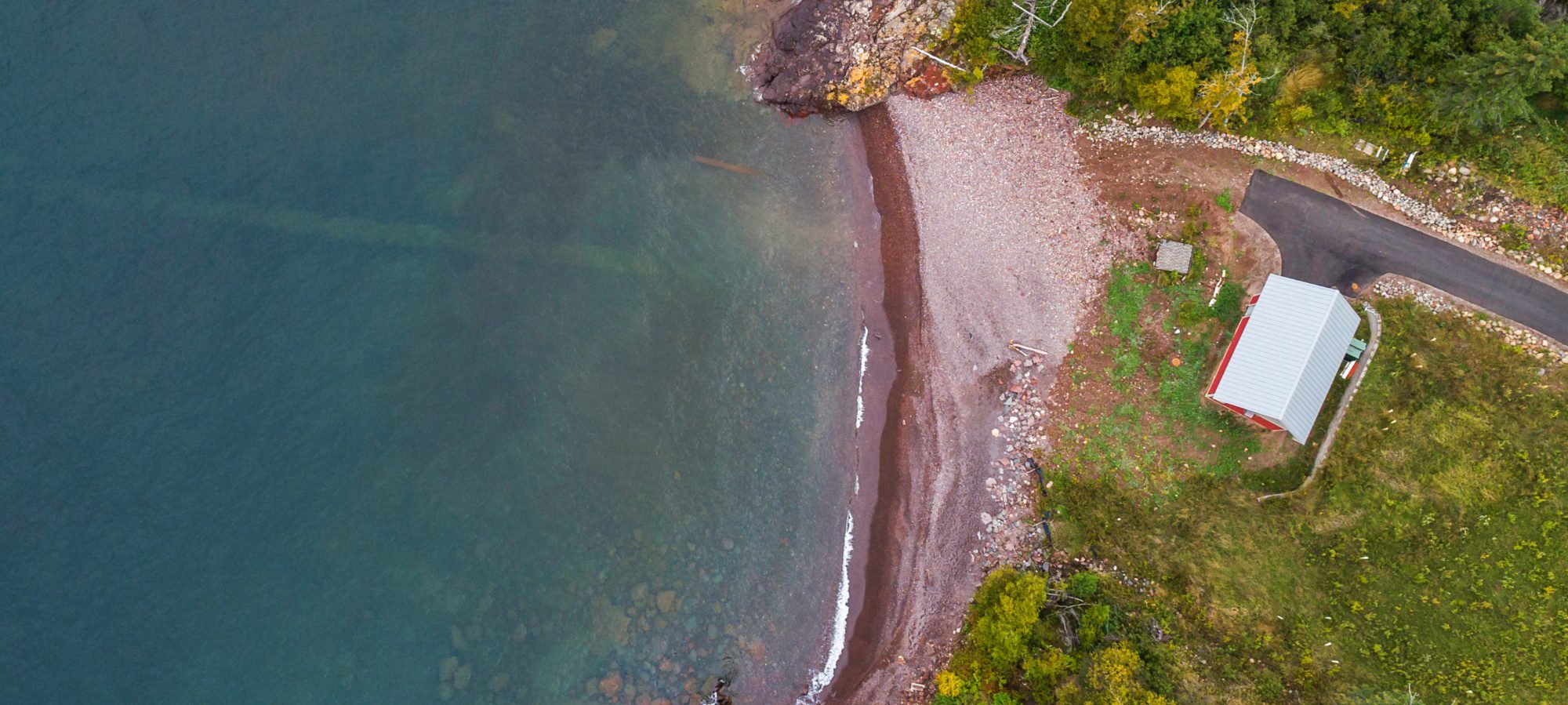 Aerial view of pipe going into water