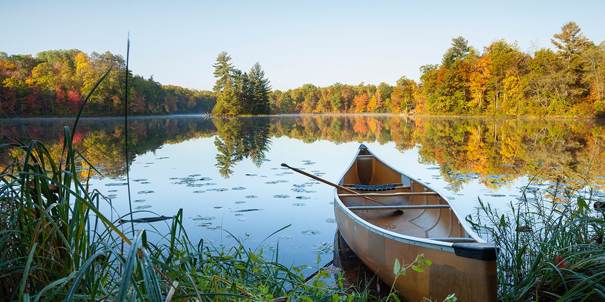 canoe on the shore of a lake