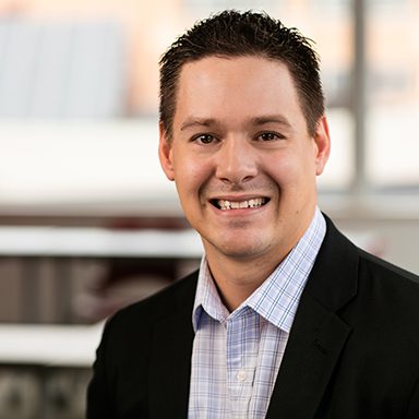 portrait of man in black suit coat and blue shirt, Adam Besse