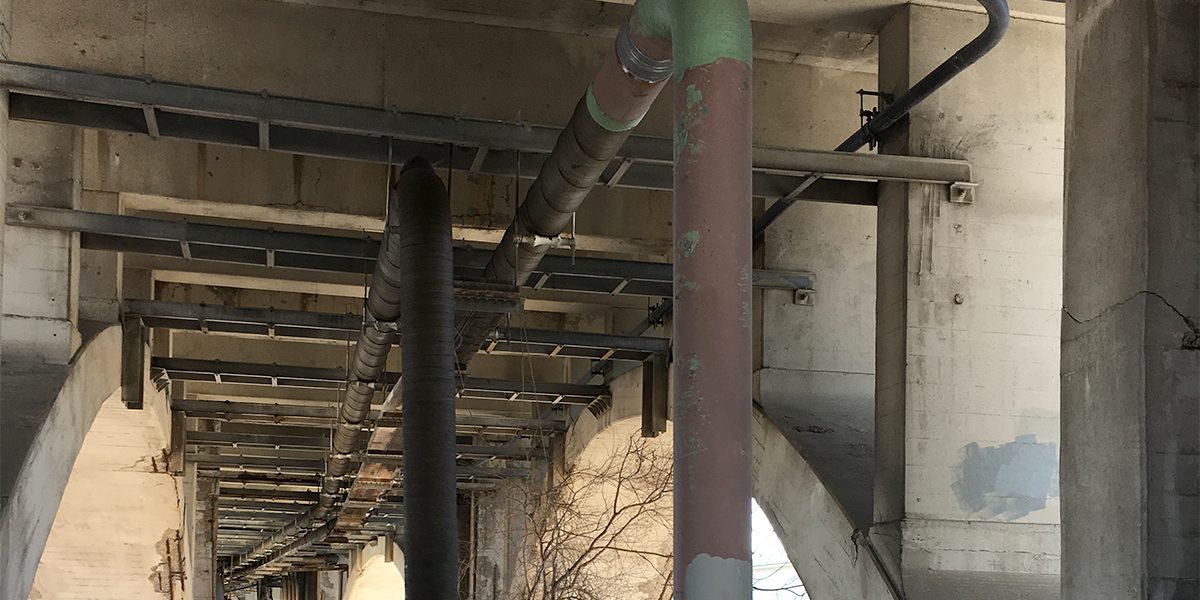 Pipe under bridge