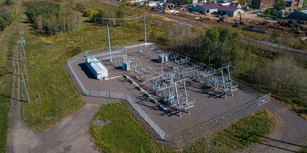 Power lines and electrical equipment near railroad tracks
