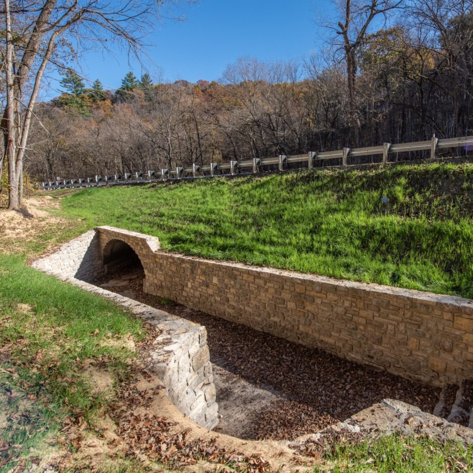 Stone culvert under roadway
