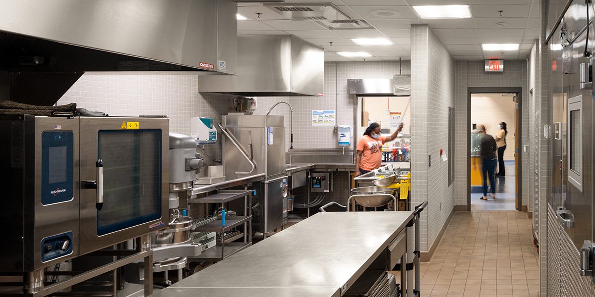 Worker in school kitchen