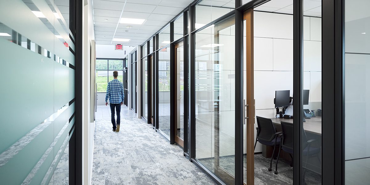 person walking down a hallway