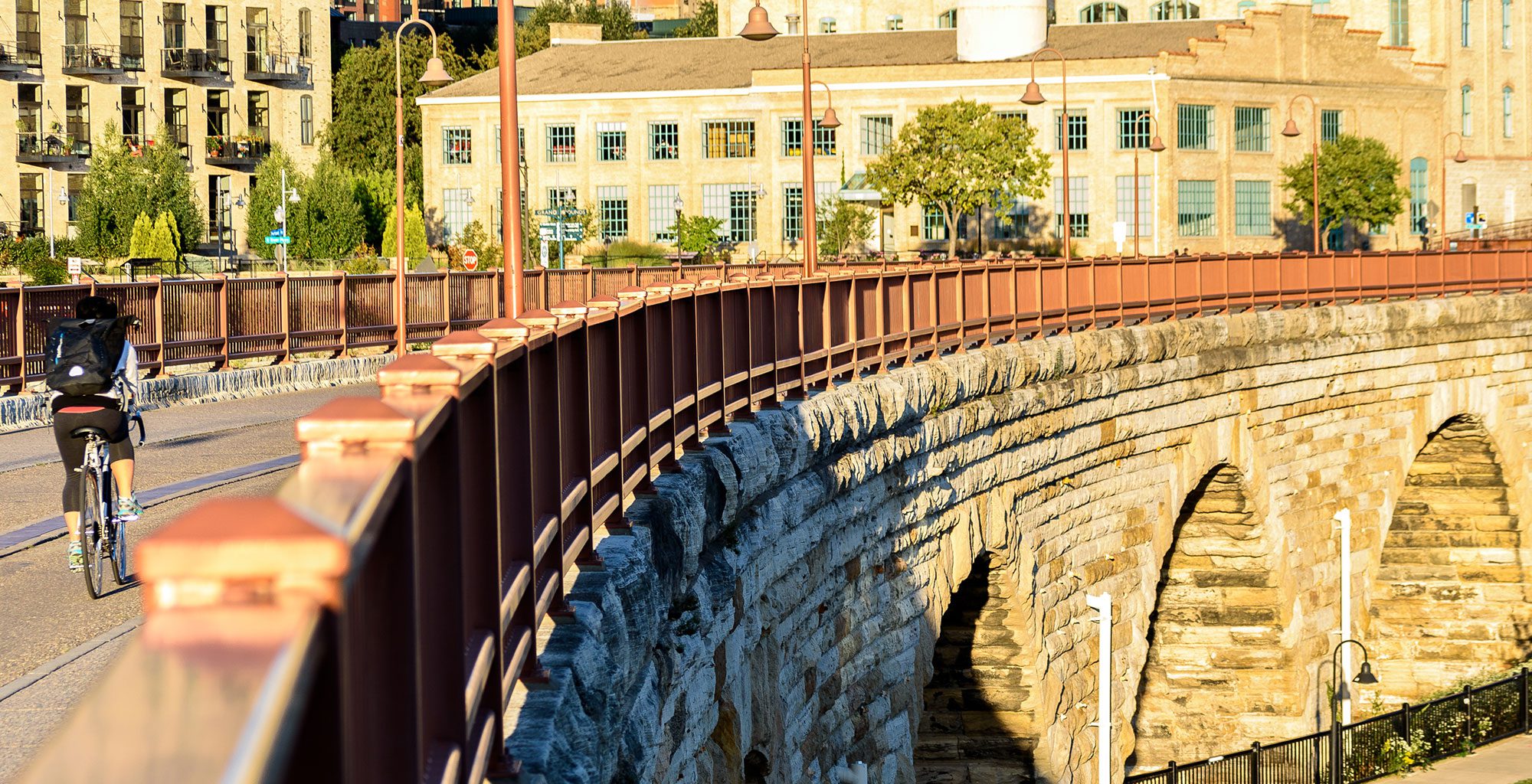 biker on stone bridge