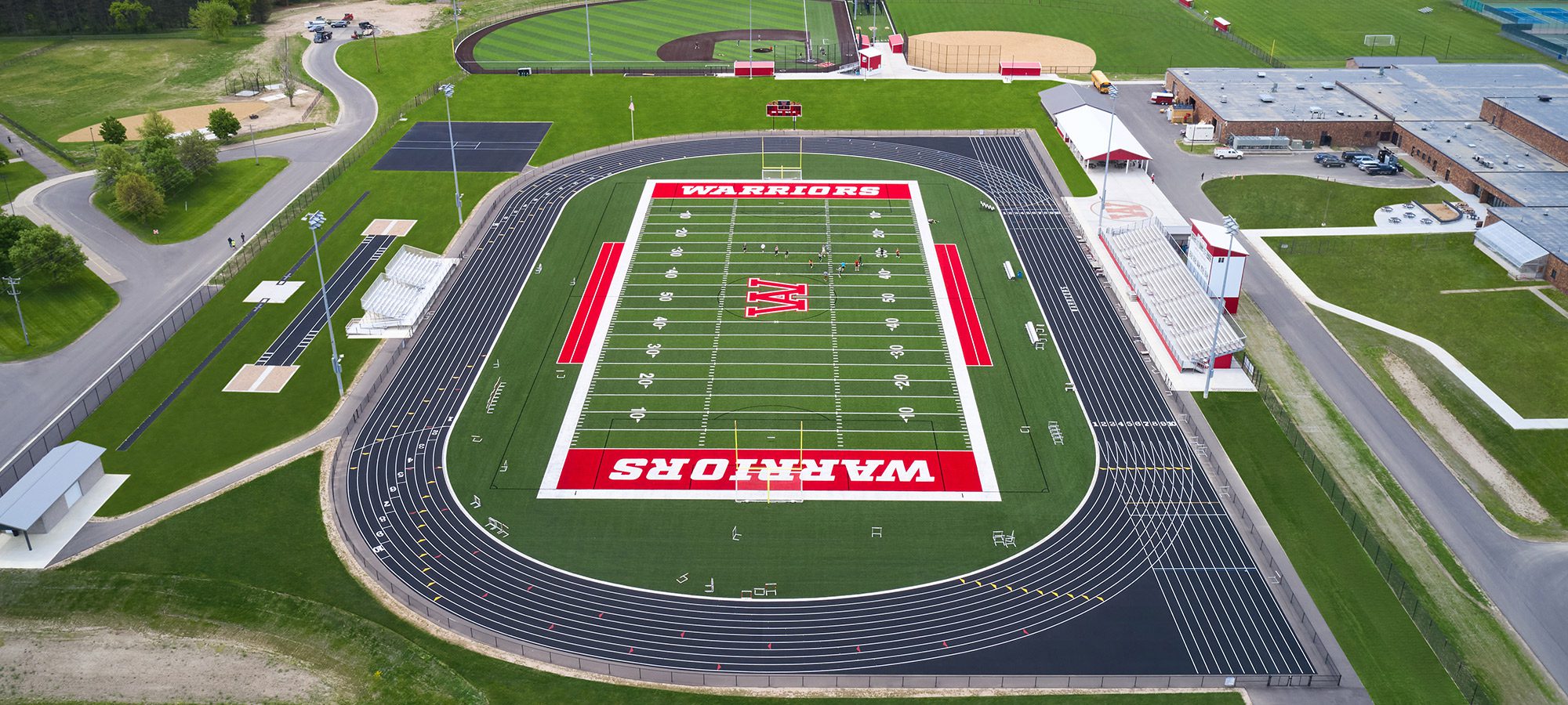 a football field surrounded by a running track viewed from above