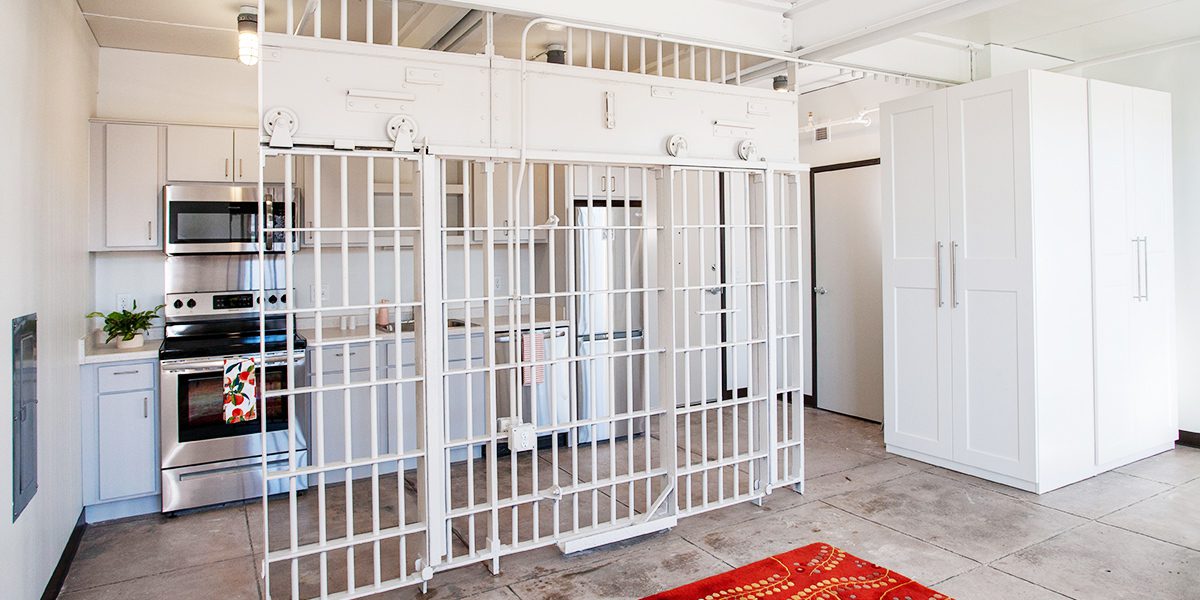 apartment kitchen with jail cell bars