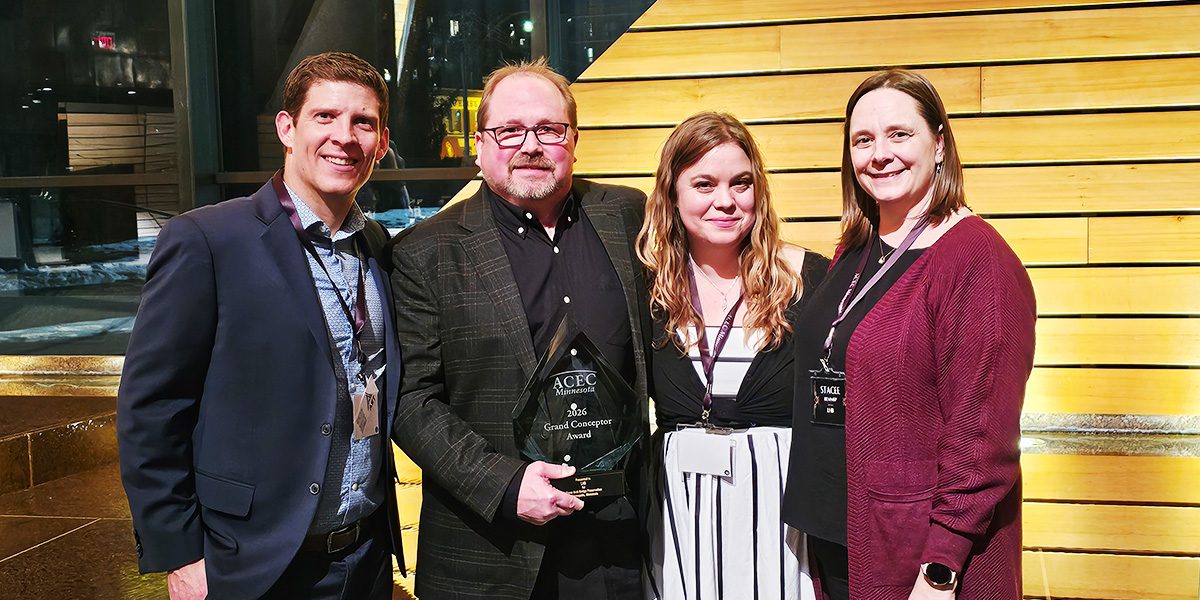 Smiling people with award